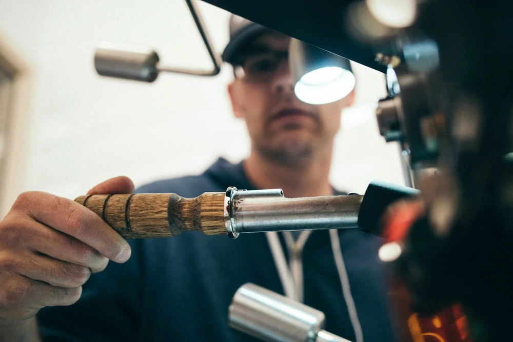 A licensed Macarthur plumber is soldering a copper joint during a burst pipes repair